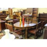 Oak extending oval table and 6+1 dining chairs