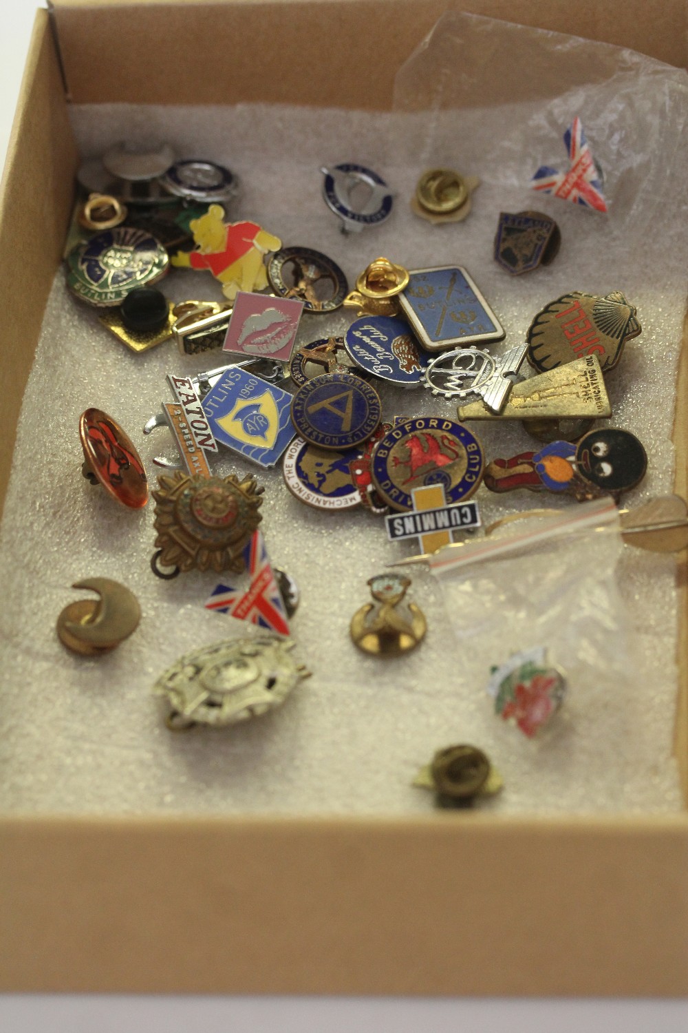 Quantity of enamelled car badge and other badges including Border Regt cap badge