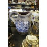 Earthenware jug with blue and white glazed band