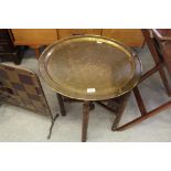 Brass tray topped table with Islamic script on folding base