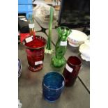 Four coloured glass vases and two bud vases