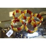 Five simulated amber bracelets