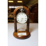 Silver pocket watch and rosewood watch stand