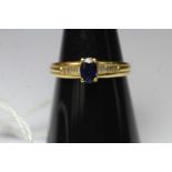 18k gold baguette diamond and blue sapphire ring, size O