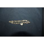 9ct gold bracelet with pierced links and padlock clasp, weight 3 grams