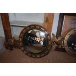 19th Century 'Federal' gilt circular convex wall mirror, with eagle cresting, old Phillips label