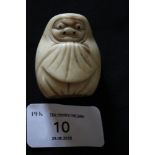 Antique Japanese carved bone netsuke, carved with figure in a shawl