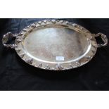 Silver plated oval two handled tray with relief cast vine ornament (slight wear)