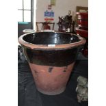 Stoneware part glazed two handled crock, the base with holes for drainage (old chips)