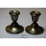 A pair of squat silver Candlesticks