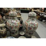 Pair of 19th Century Cantonese Chinese porcelain vases and covers, slight gilding/decoration wear