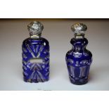 Two Victorian white metal (thought silver) mounted blue flashed and cut glass scent bottles,