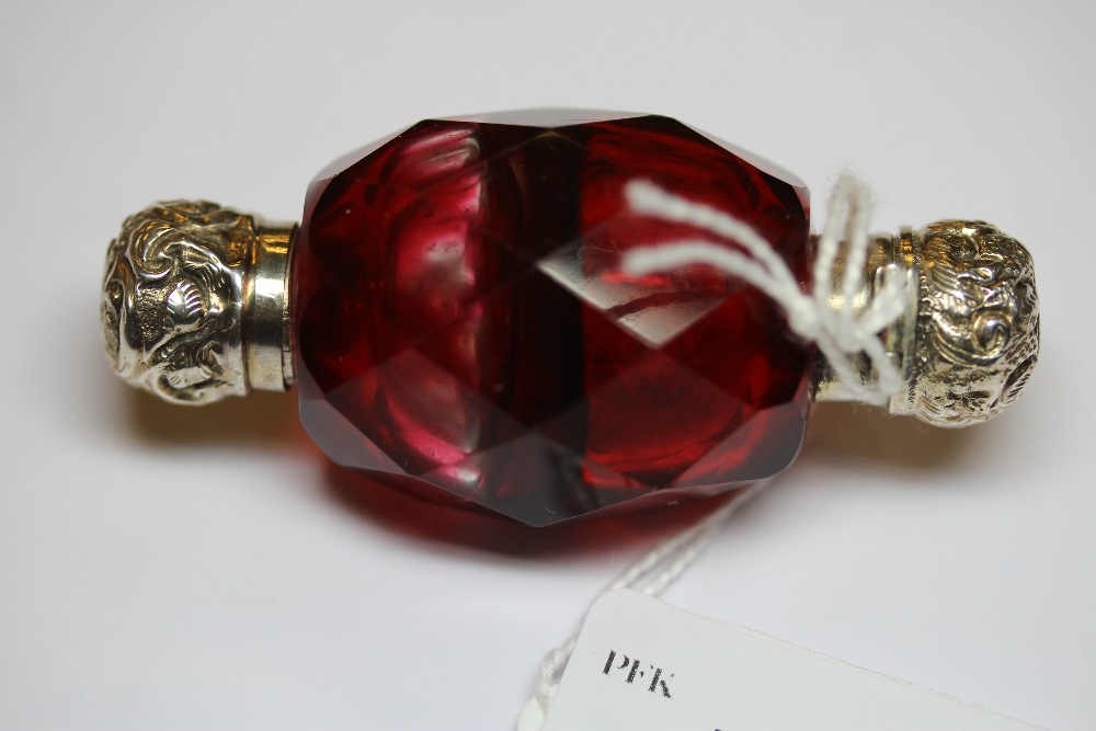 Victorian white metal (thought silver) mounted double ended ovoid ruby glass scent bottle, with