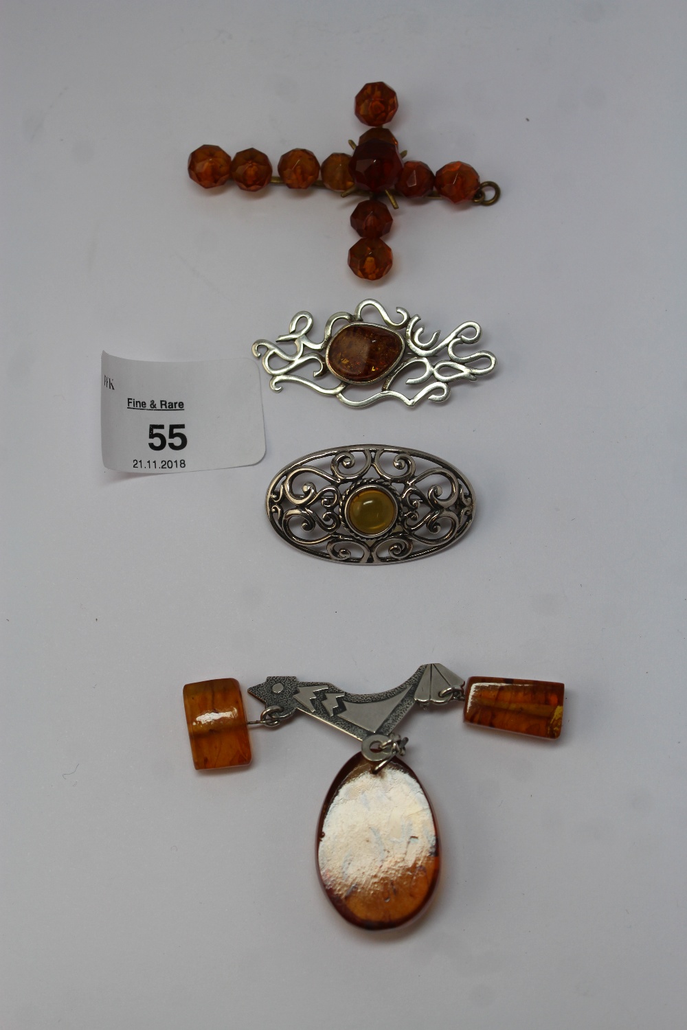Four pieces of amber set jewellery