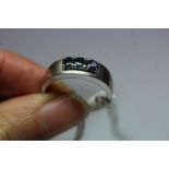 18ct white gold mounted sapphire ring, the three stones each approx 0.10ct, ring size P