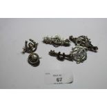 Six Victorian silver brooches - mostly featuring horseshoes