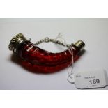 Victorian white metal (thought silver) mounted ruby glass scent bottle of Cornucopia shape, the body
