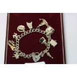 Silver charm bracelet, gross weight 49 grams