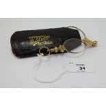 Pair of gilt metal lorgnettes, with slip case