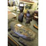 Carved wooden face mask and two African carved wooden busts