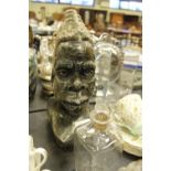 African carved stone head