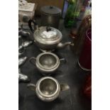 Hand beaten 3 piece pewter tea service by T.W. Ward and biscuit barrel by Cobral