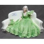 11" Wide Continental Figure of a Woman in a Green Dress Sitting on a Sofa, marked 266, with old