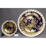 Two Royal Crown Derby Blue Ground Plates with Gilded Decoration of Birds, one 16cm and the other