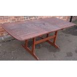 Hardwood extending garden table, 200 x 90 fully open. No condition reports for this sale.