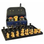 A boxed set of chess pieces and a set of bowls No condition reports for this sale.