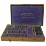 Cased set of opticians testing lenses, Carpenter & Westley, London. No condition reports for this