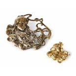 A Victorian Art Nouveau yellow gold stylized bust brooch, lady with waved hair design, set with