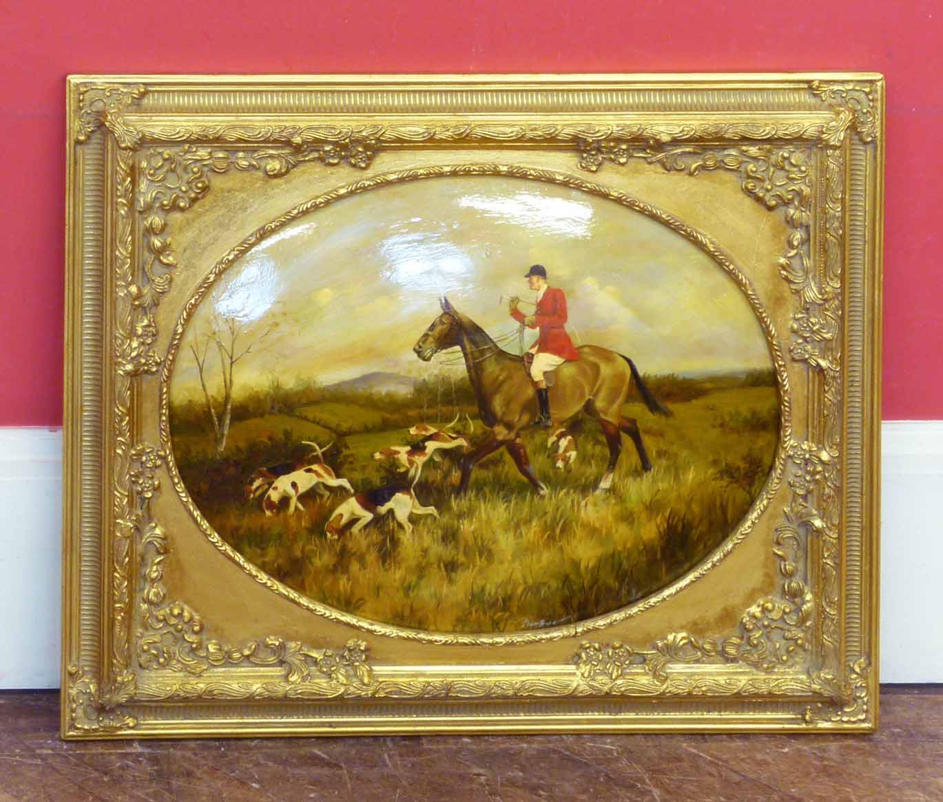 An oval gilt framed reproduction oil painting of huntsman and hounds No condition reports for this