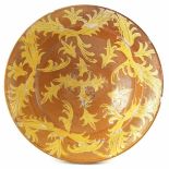 Slipware bowl, decorated with a stylised leaf pattern, early 19th century, 29cm diameter Condition