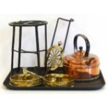 A cast iron trivet, copper kettle, a pair of brass chamber steads and an adjustable hearth trivet No