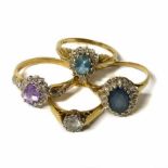 Three 9ct gold cluster dress rings comprising a blue topaz and diamond cluster, a blue topaz and