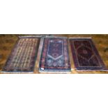 Three Asian rugs. No condition reports for this sale.