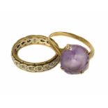 Two 9ct gold dress rings comprising a solitaire amethyst set ring and a white stone set full