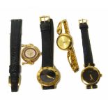 Three ladies Gucci gold plated watches on leather straps, together with gold plated ladies