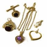 Four 9ct gold stone set pendants one with chain together with an open work 9ct gold heart shaped