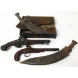 Two Kukri knives, leather holster belt pouch and two replica flint lock pistols. No condition