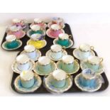 Nineteen Aynsley coffee cans and saucers in Harlequin colours No condition reports for this lot.