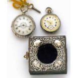 Two ladies silver pocket watches one with a case No condition reports for this lot.