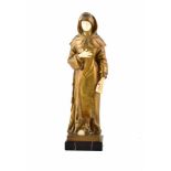 A bronze and ivory statuette of a nun by Montini. The robed figure has ivory hands, feet and face