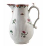 Worcester water jug circa 1760, painted with scattered famille rose flora on a reeded body, 18cm