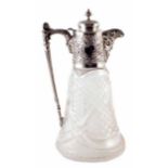 Early 20th century cut glass claret jug with embossed silver mounts and mask head lip, makers