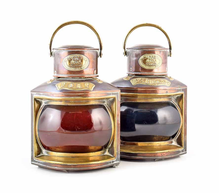 A pair of brass ships lanterns by army and navy manufacturers W. Nunn & Co, London. For port and