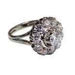 18ct white gold diamond flower head cluster ring, 0.51ct central brilliant cut diamond in raised