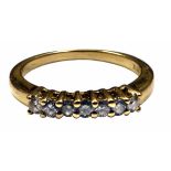 A diamond seven stone half hoop 18ct yellow gold ring, the seven round brilliant diamonds