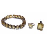 A 9ct rose gold citrine line bracelet with matching single stone set ring and pendant, the